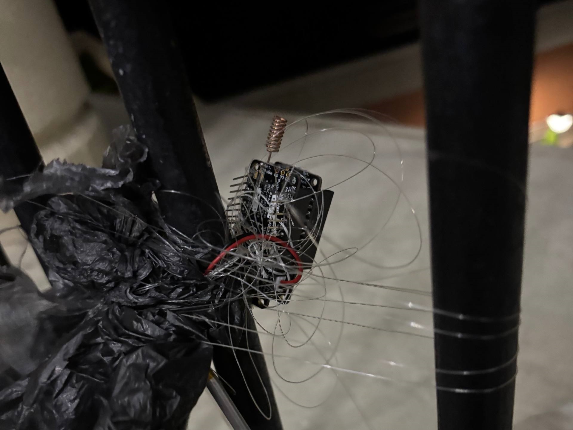 Feather M0 with LoRa module and hand-built quarter-wave ground-plane antenna made from copper wire and drinking straw supports